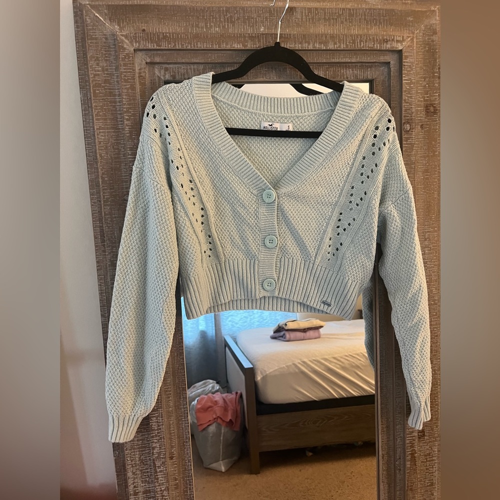 Blue Hollister cropped sweater with buttons.
